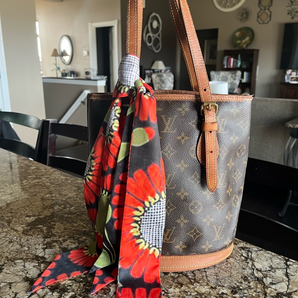 Authentic vintage Louis Vuitton PM canvas bucket.